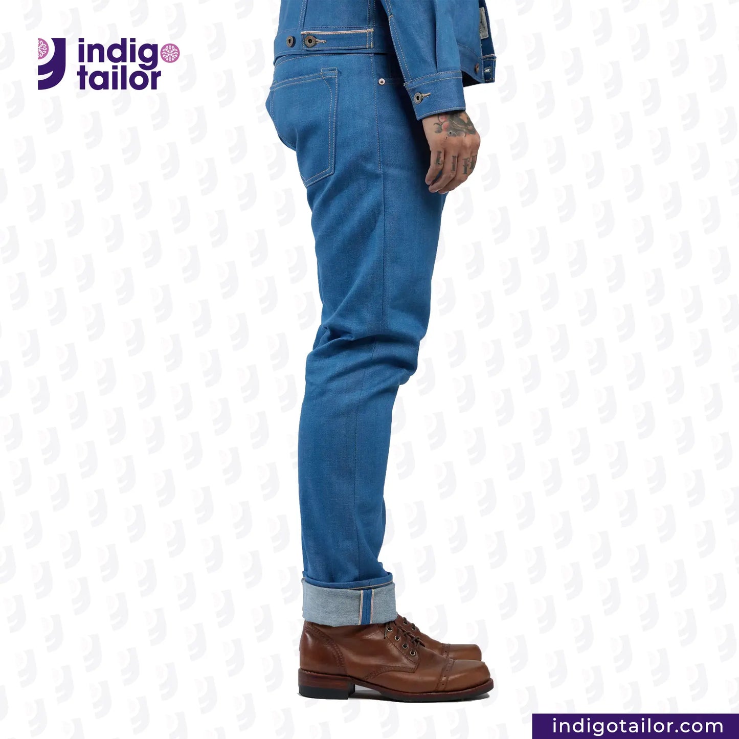 Person wearing AOZORA SKY BLUE DENIM jeans and brown boots with 'Indigo Tailor' logo.