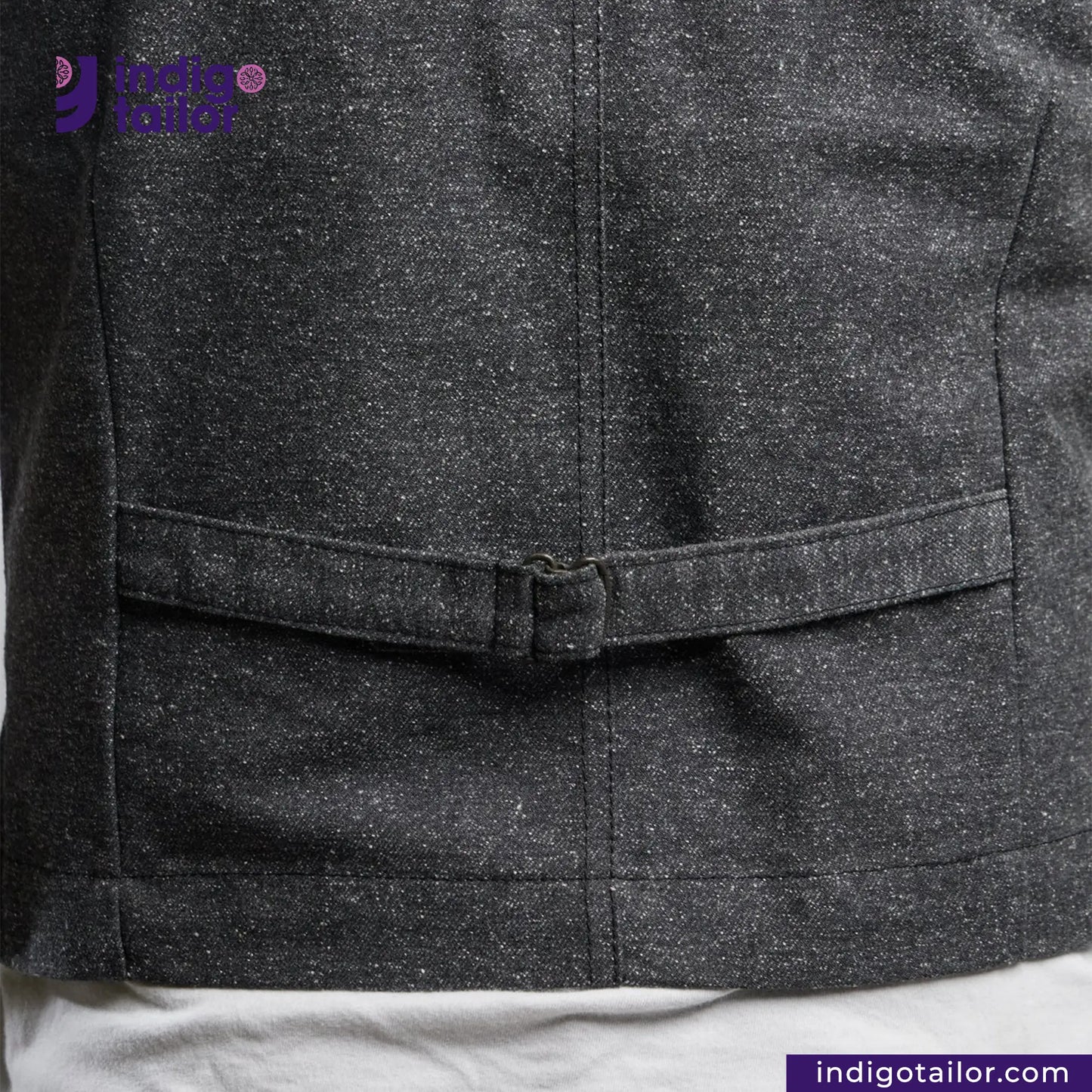 Close-up of a BLACK TWEED WORK VEST with a visible brand logo on a white background