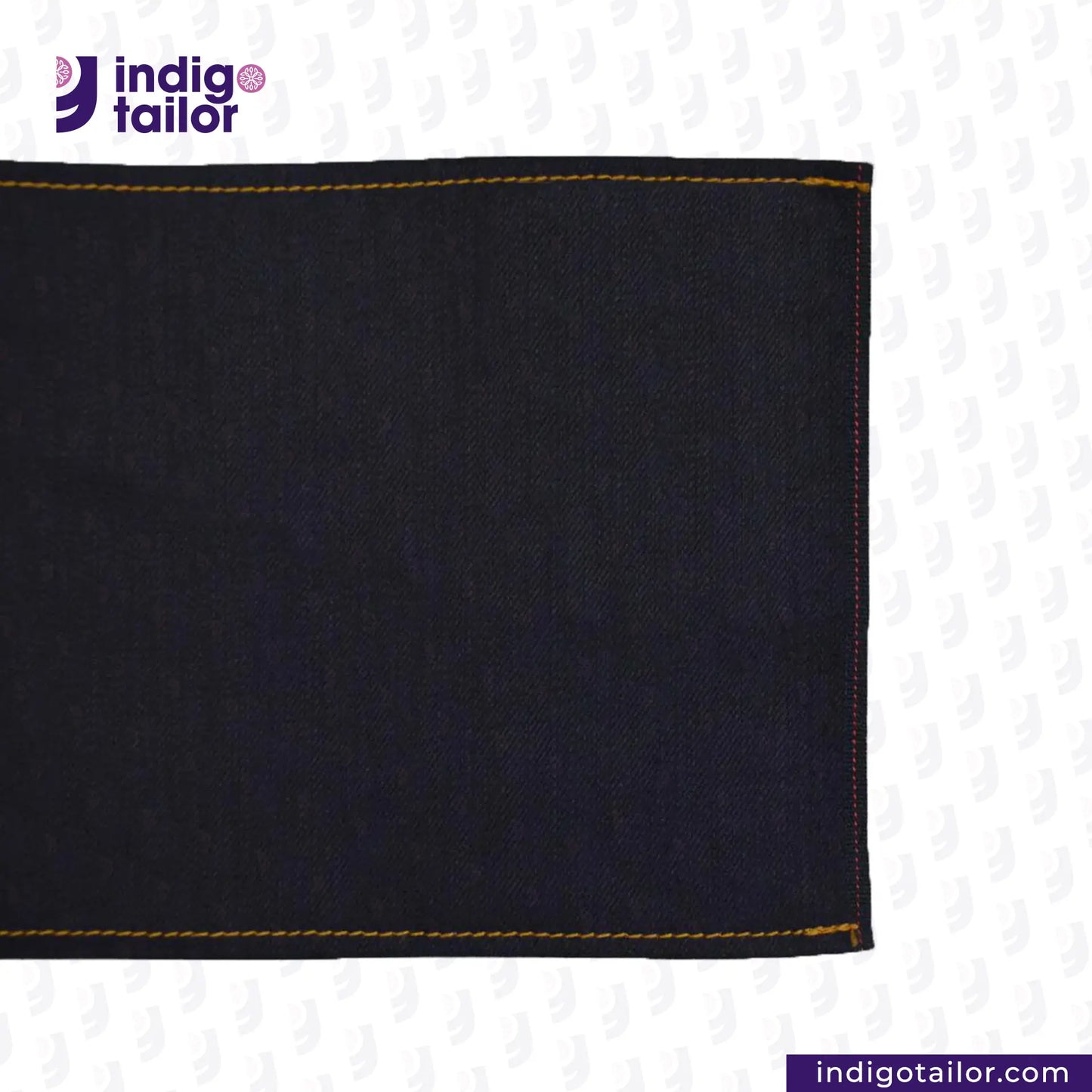 Close-up of dark denim fabric with yellow stitching on a white background, featuring the Indigotailor logo. BLUE ROYAL INDIGO x BLACK SELVEDGE DENIM