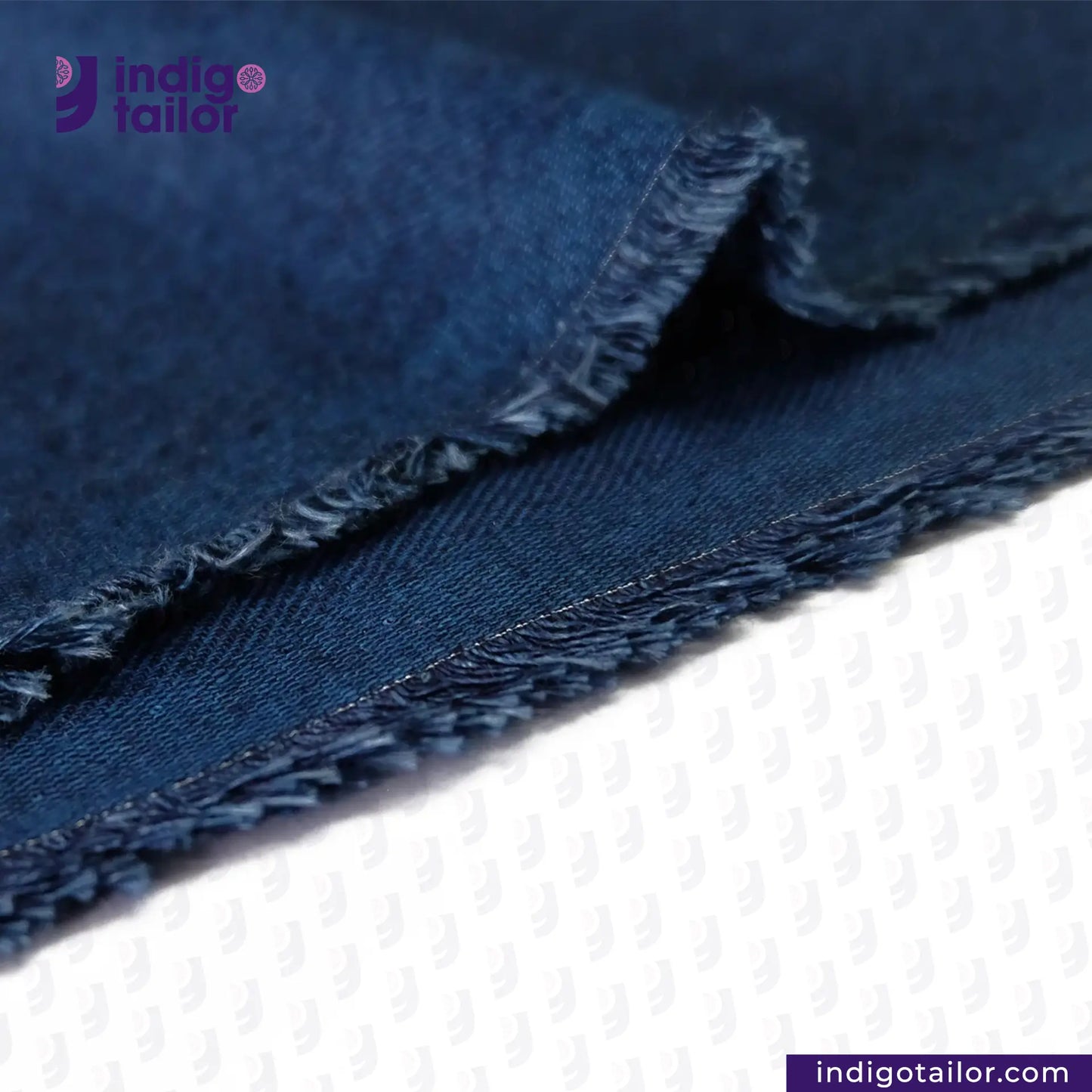Close-up of BRUSHED INDIGO VIBRANT BLUE fabric with 'Indigotailor' branding.
