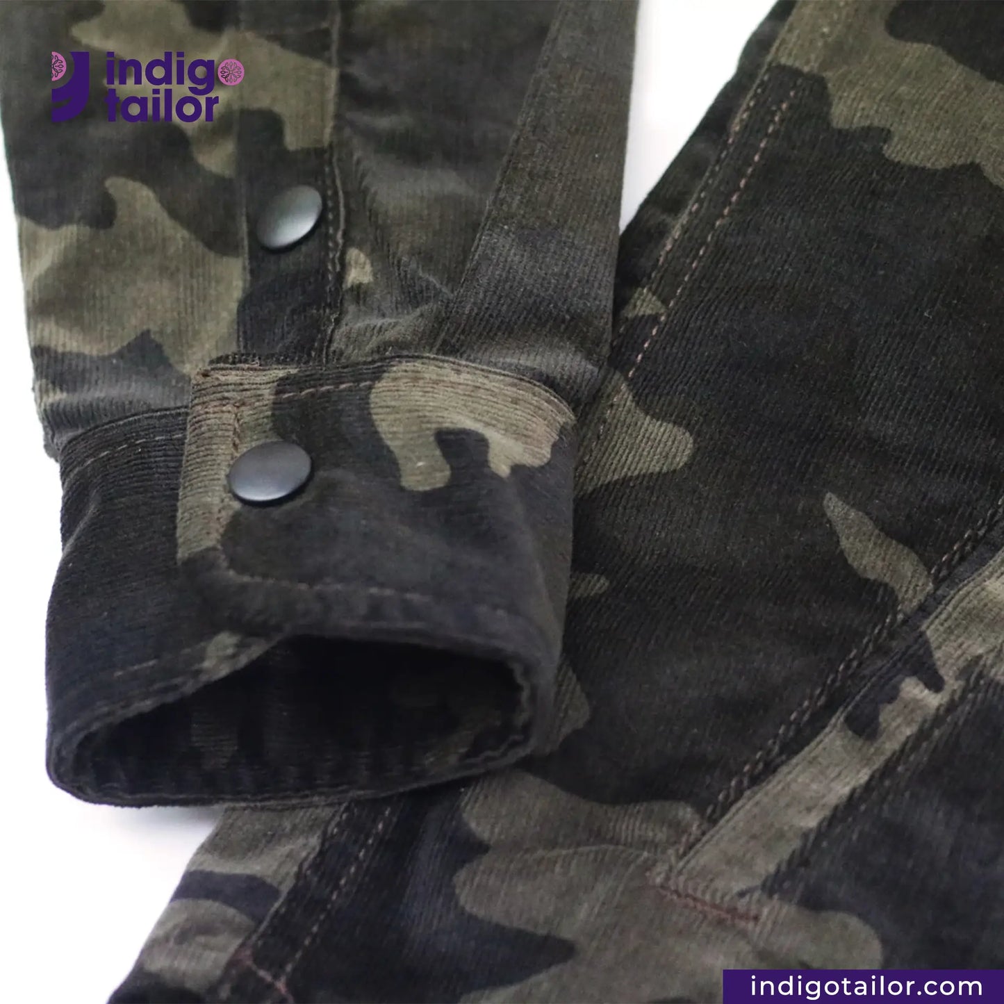 CORD CAMO OVERSHIRT Camouflage jacket with button details on a white background, featuring the Indigotailor logo.