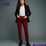 Woman wearing a black blazer, white shirt, and Chino Burgundy pants with 'Indigotailor' branding.