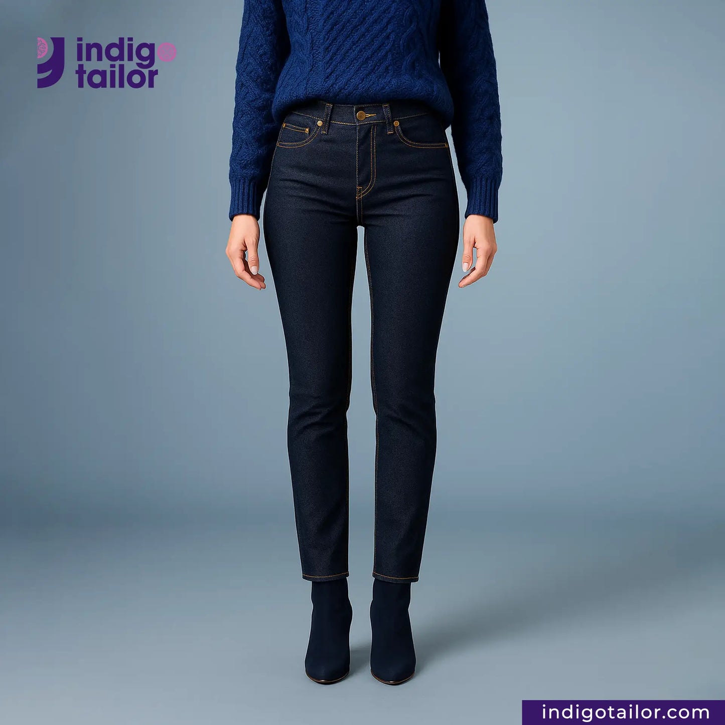 Person wearing DEEP INDIGO RAINBOW STRETCH SELVEDGE DENIM jeans and a matching sweater with 'indigotailor' branding.