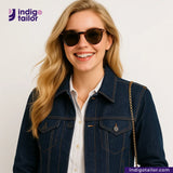 Woman wearing a DEEP INDIGO STRETCH SELVEDGE DENIM jacket and sunglasses with 'Indigotailor' branding.