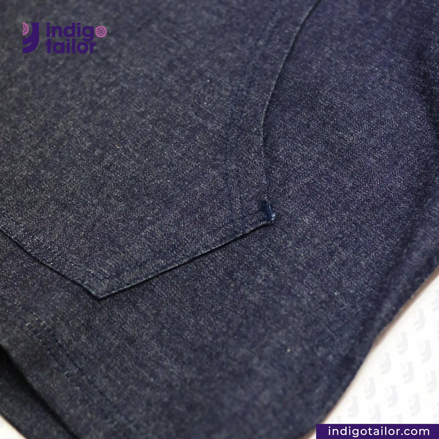 Close-up of a DENIM HOODIE pocket with a pocket, featuring the Indigotailor logo.