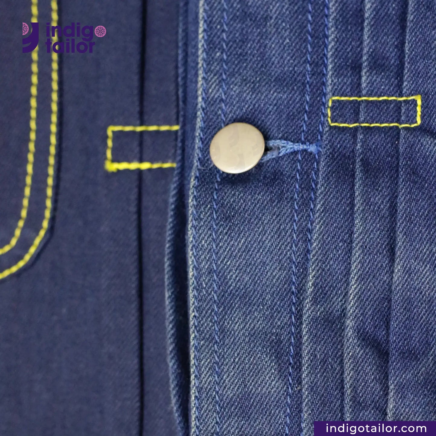 Close-up of DOUBLE DIPPED TRIPLE PLEAT REPRO denim fabric with yellow stitching and a button, featuring the Indigotailor logo.