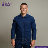 Man wearing a EASY JACKET INDIGO CANVAS with Indigotailor logo and website on a gray background