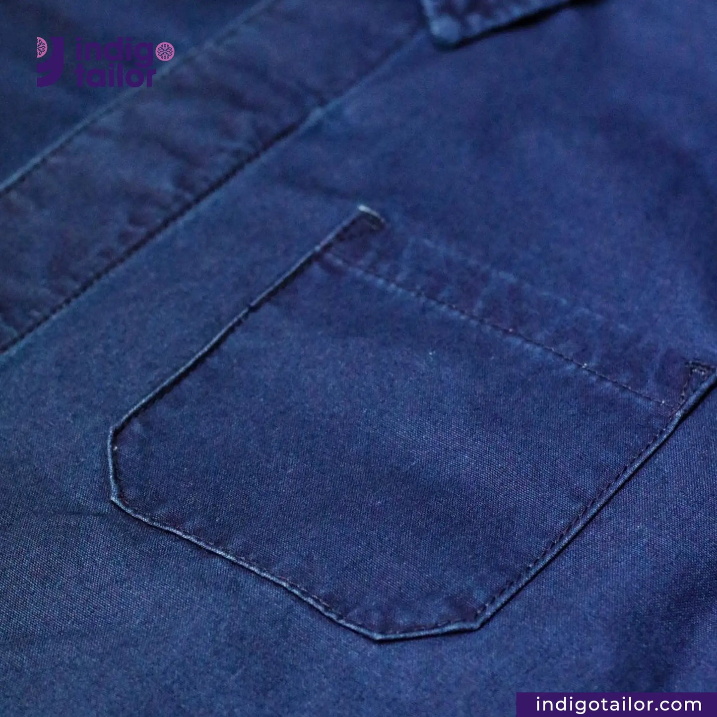 Close-up of a EASY JACKET INDIGO CANVAS pocket with 'Indigo Tailor' branding.
