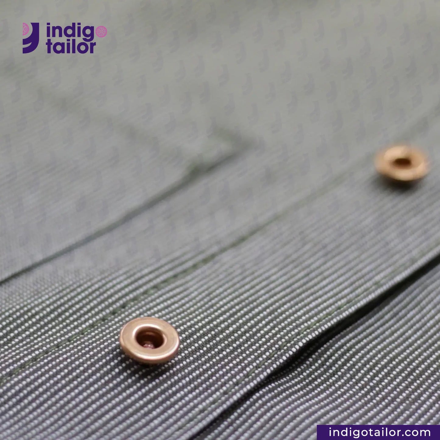 Close-up of a button on EASY JACKET OLIVE WABASH ONE WASH with 'indigotailor' branding.