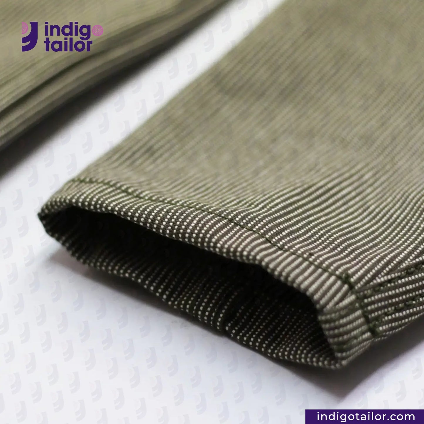Close-up of EASY JACKET OLIVE WABASH ONE WASH with 'Indigotailor' logo and website on a white background