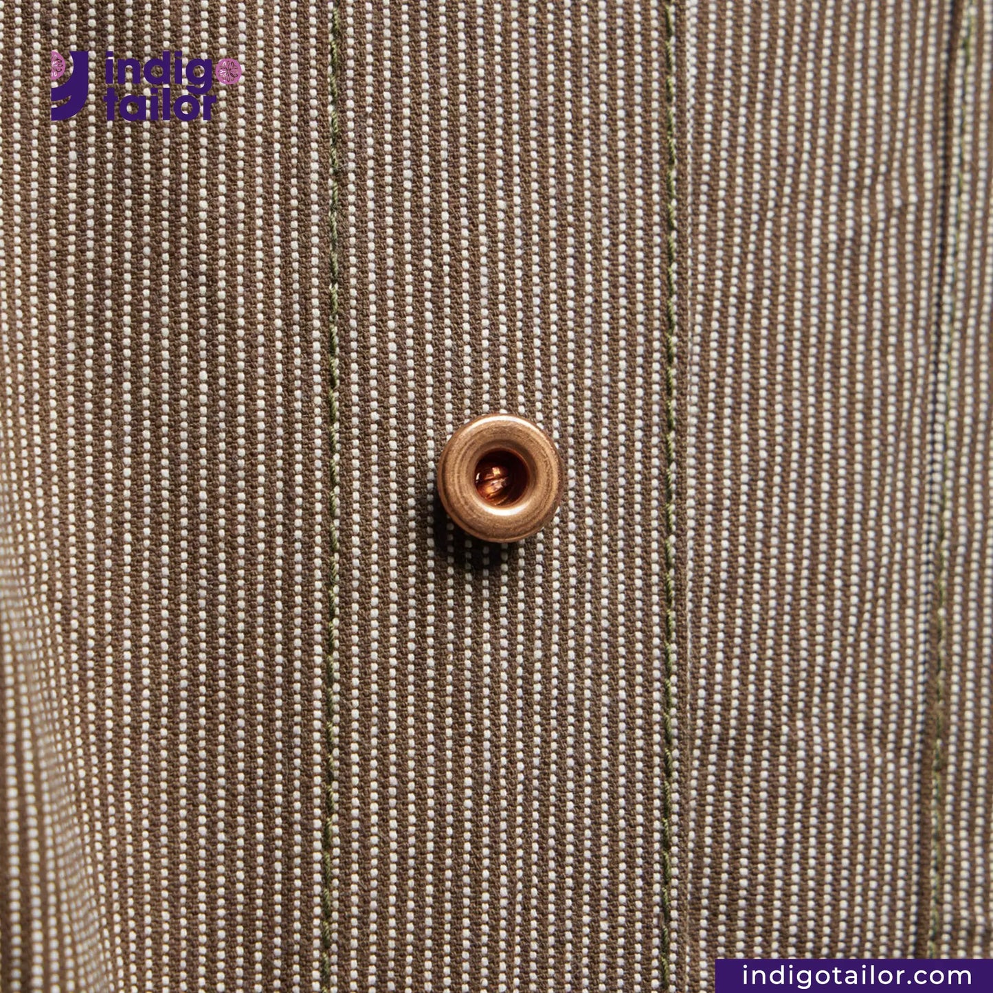 Close-up of a button on EASY JACKET OLIVE WABASH ONE WASH with 'Indigotailor' branding.