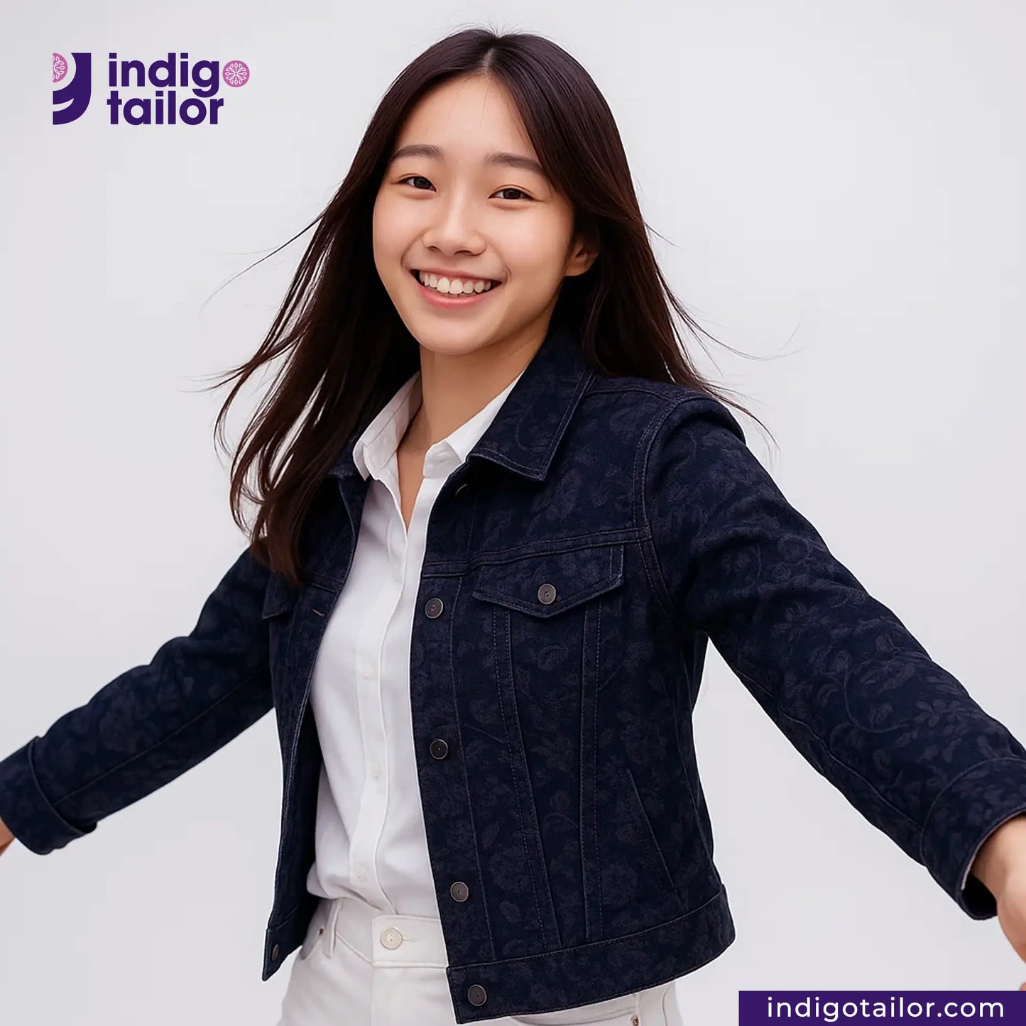 Woman wearing a FLORAL EMBOSSED DENIM jacket over a white shirt with 'Indigo Tailor' branding.