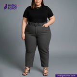 Woman wearing a black top and GREYHOUND TWEED HOUNDSTOOTH pants with an Indigo Tailor logo on a gray background