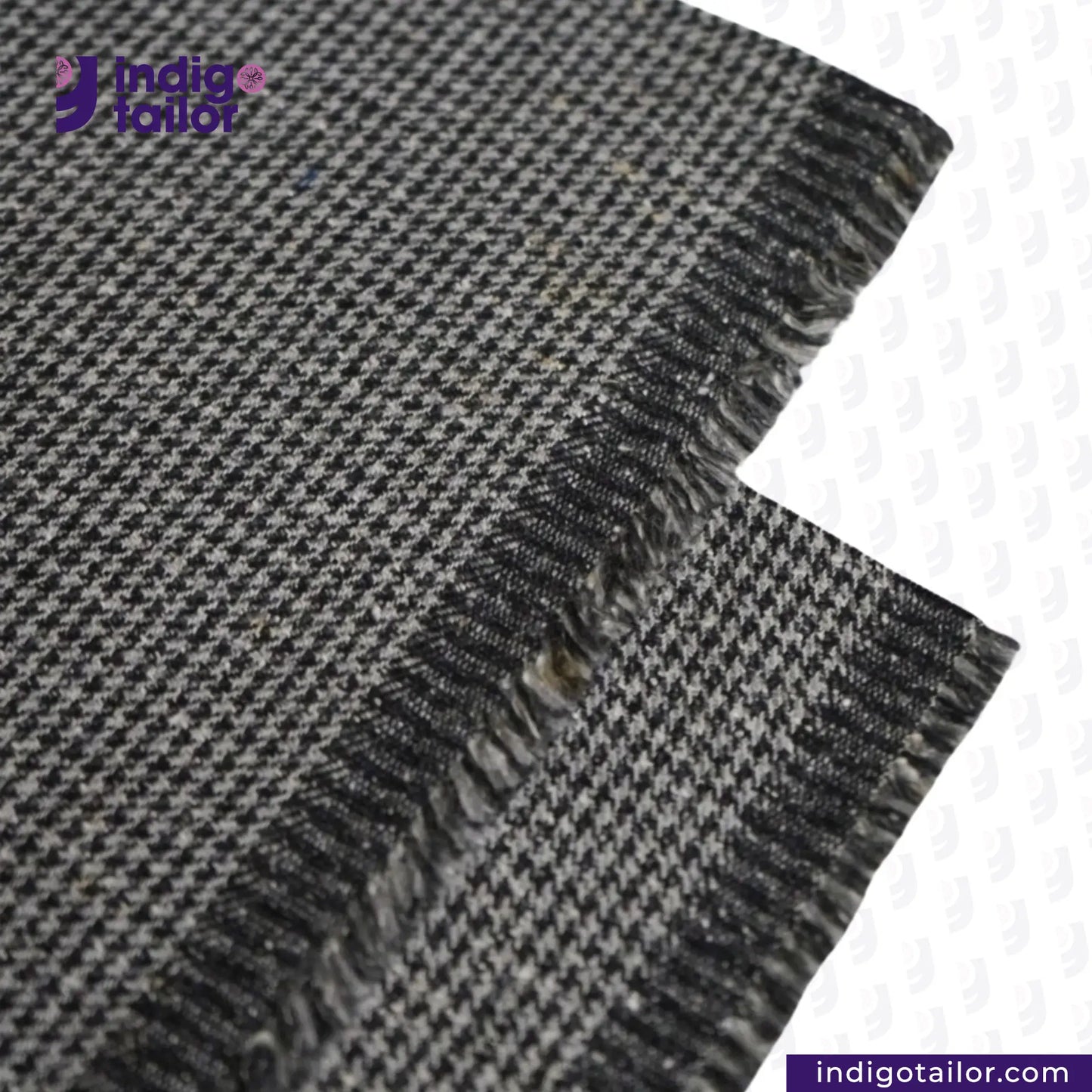 Close-up of GREYHOUND TWEED HOUNDSTOOTH fabric with 'Indigo Tailor' logo.