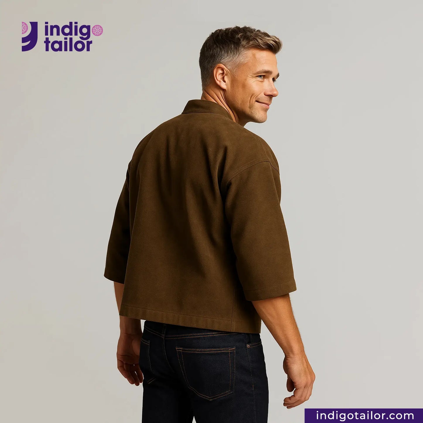 Man wearing a HAORI JACKET BROWN SUEDE and dark jeans, standing against a plain background with 'Indigo Tailor' branding.