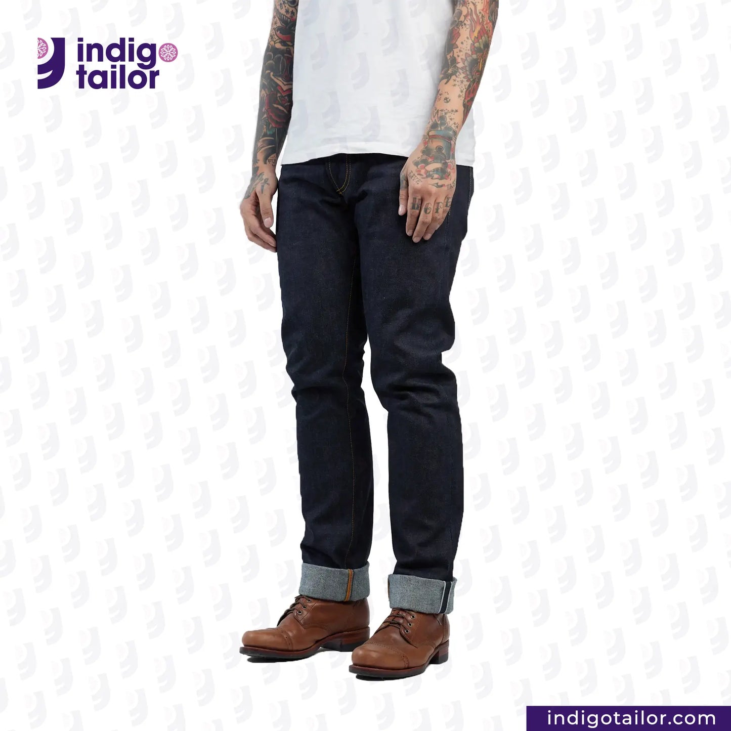 Person wearing HEAVYWEIGHT DEEP INDIGO DENIM jeans and brown boots with 'Indigotailor' logo in the corner.