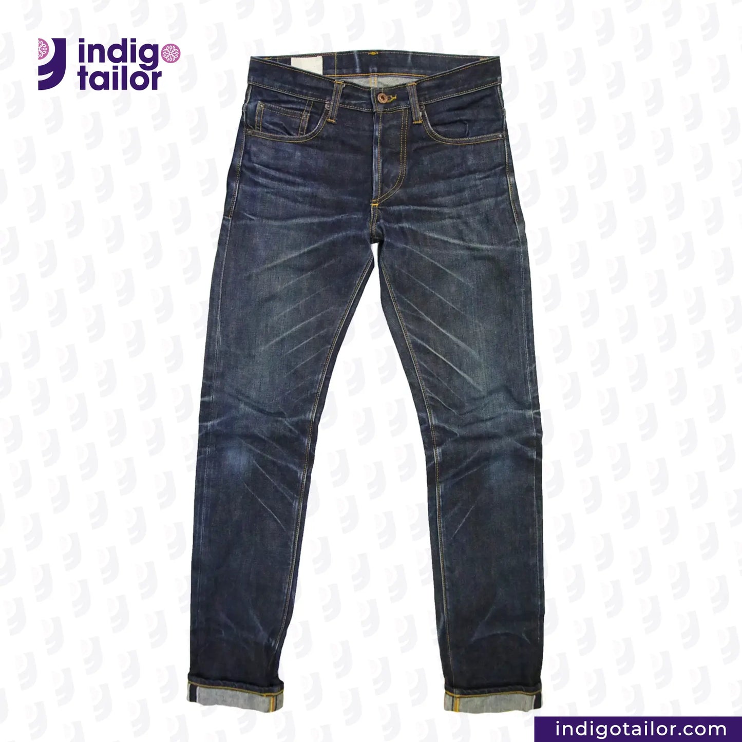 Pair of blue jeans with 'Indigotailor' logo on a white background