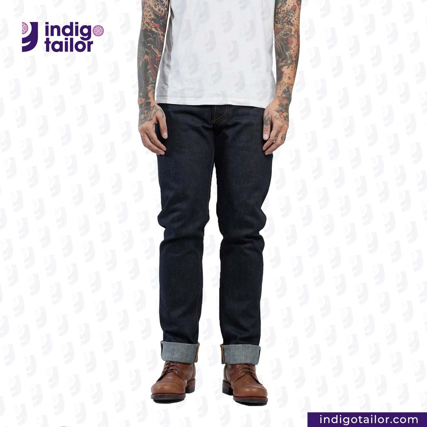 Person wearing dark jeans and brown boots with 'Indigo Tailor' logo and website URL on a white background.