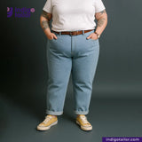 Person wearing ICE BLUE SELVEDGE DENIM jeans and a white shirt with a dark background