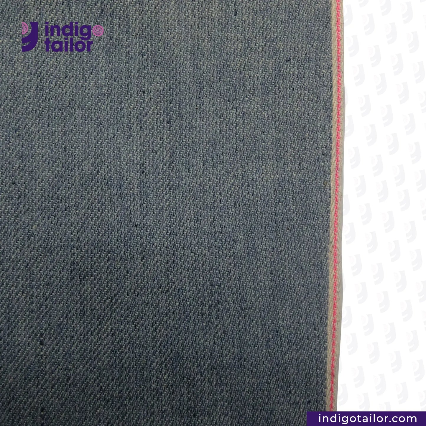 Close-up of ICE BLUE SELVEDGE DENIM fabric with a visible brand logo and website.