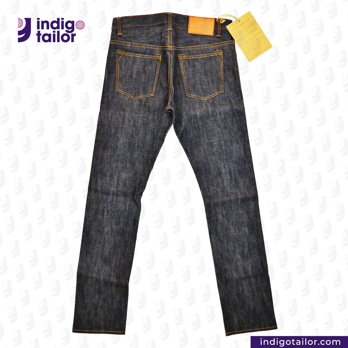 Pair of INDIGO GREY DENIM jeans with a yellow tag on a white background, featuring the 'Indigotailor' brand.