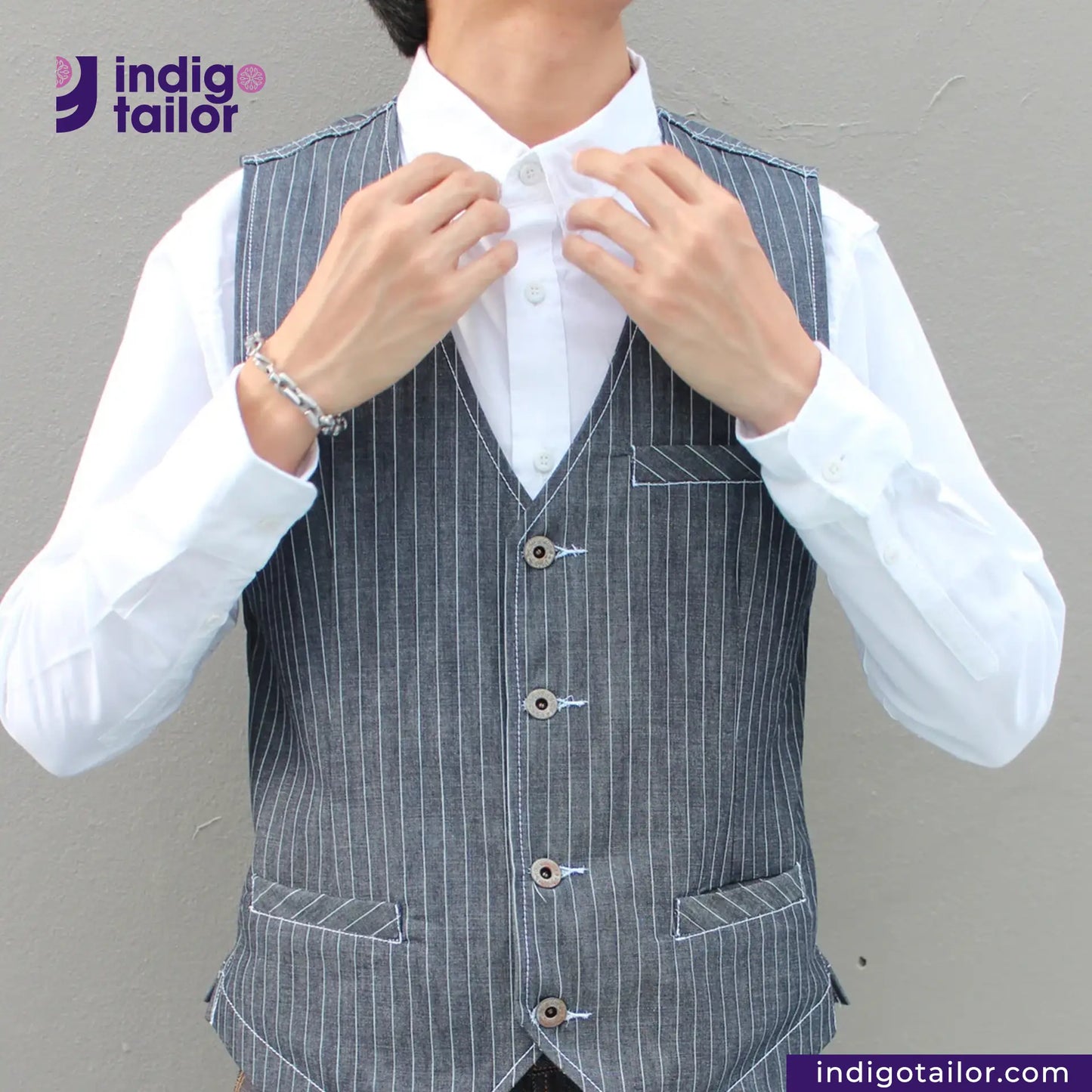 Person wearing a INDIGO VINTAGE STRIPE WORK VEST over a white shirt with 'indigotailor' branding.