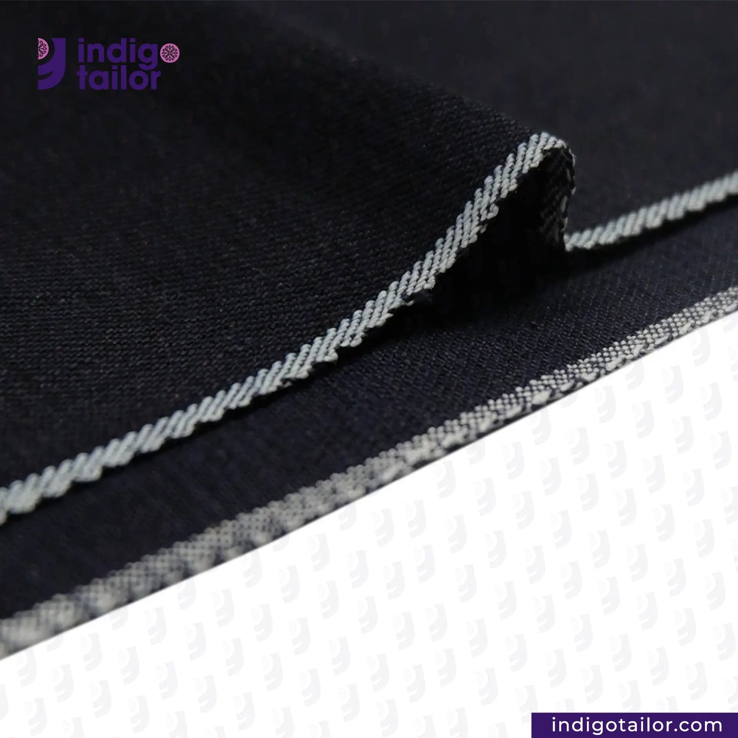 Close-up of INDIGO x INDIGO SUMMER TWILL SELVEDGE DENIM fabric with white stitching, featuring the Indigotailor logo.