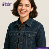 Woman wearing a IRONMAN HEAVYWEIGHT SELVEDGE DENIM jacket with Indigo Tailor logo and website on a beige background