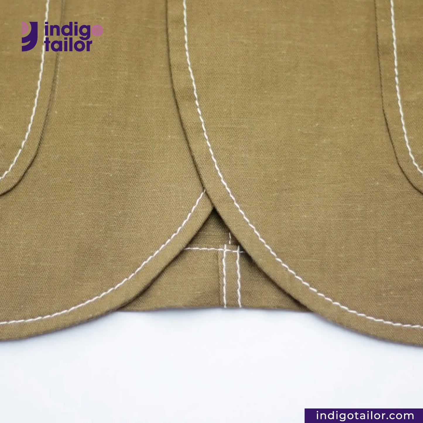 KHAKI HERRINGBONE COVERALL JACKET with white stitching on a white background, featuring the Indigo Tailor logo.