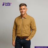 Man wearing a Khaki Bomber Jacket and dark jeans with 'Indigo Tailor' logo above.