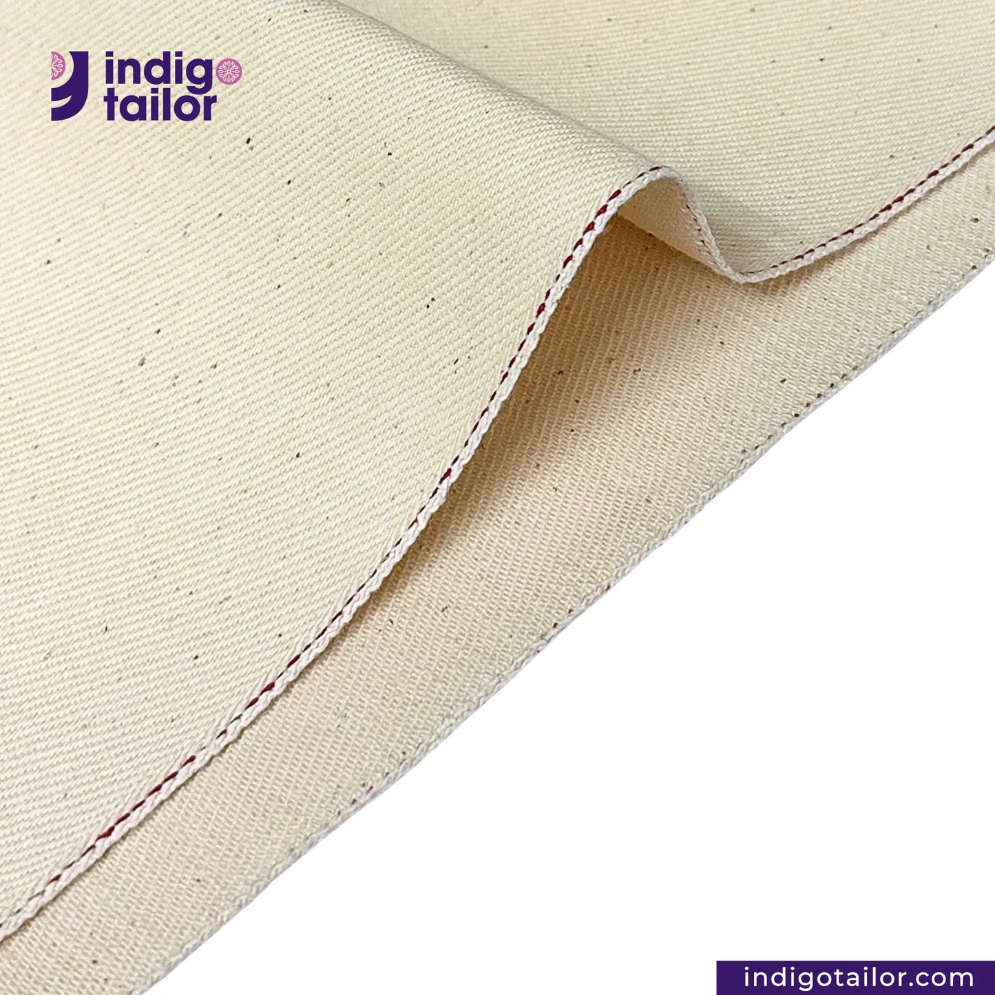 Close-up of LOW TENSION HEAVY KINARI SELVEDGE DENIM fabric with a visible seam, featuring the Indigotailor logo.