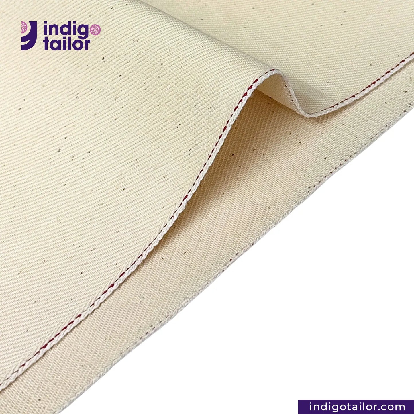 Close-up of LOW TENSION HEAVY KINARI SELVEDGE DENIM fabric with a visible seam, featuring the Indigotailor logo.