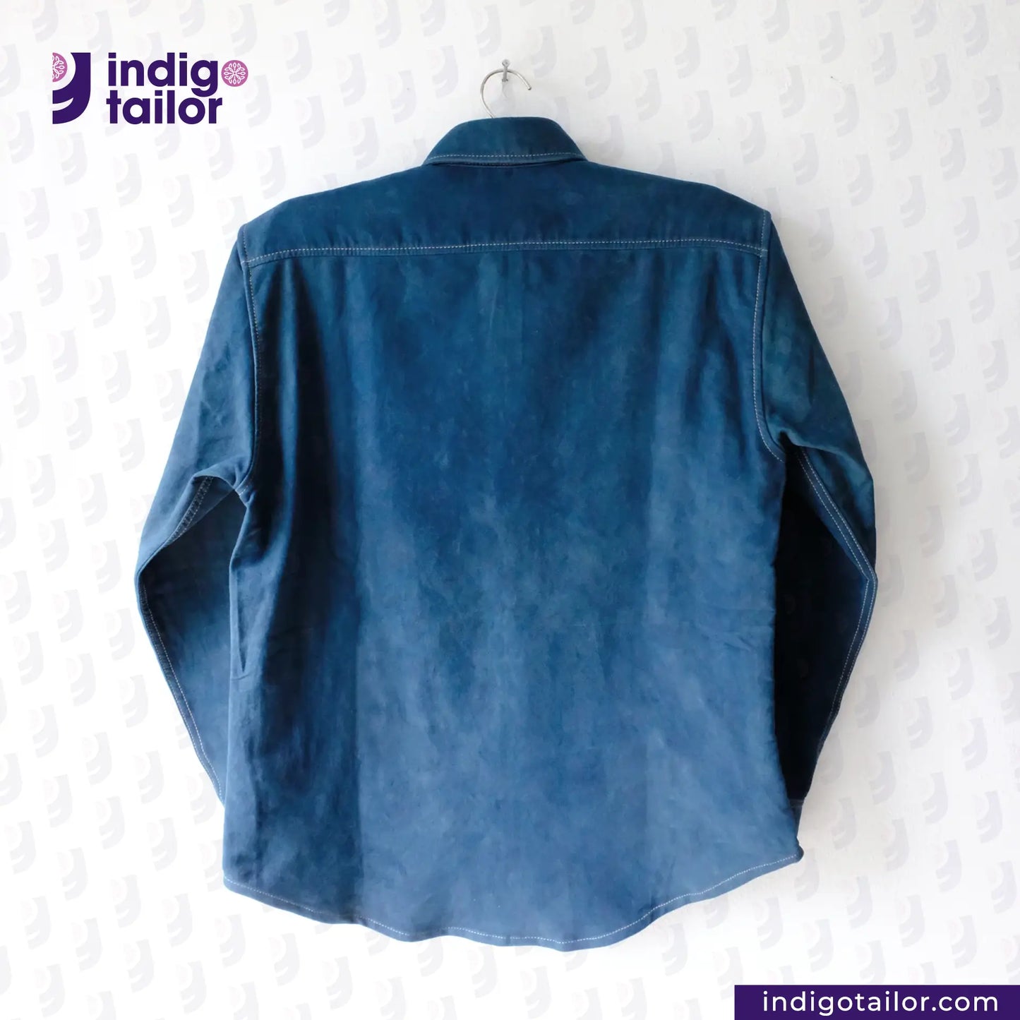 NATURAL INDIGO DYED SUEDE shirt on a hanger with 'Indigo Tailor' logo above.