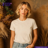Woman wearing a OFF-WHITE PAISLEY JACQUARD t-shirt against a warm-toned background with 'Indigotailor' branding.