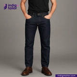 Person wearing OMOTAI GREENCAST SELVEDGE DENIM jeans and brown shoes on a gray background with 'Indigotailor' branding.