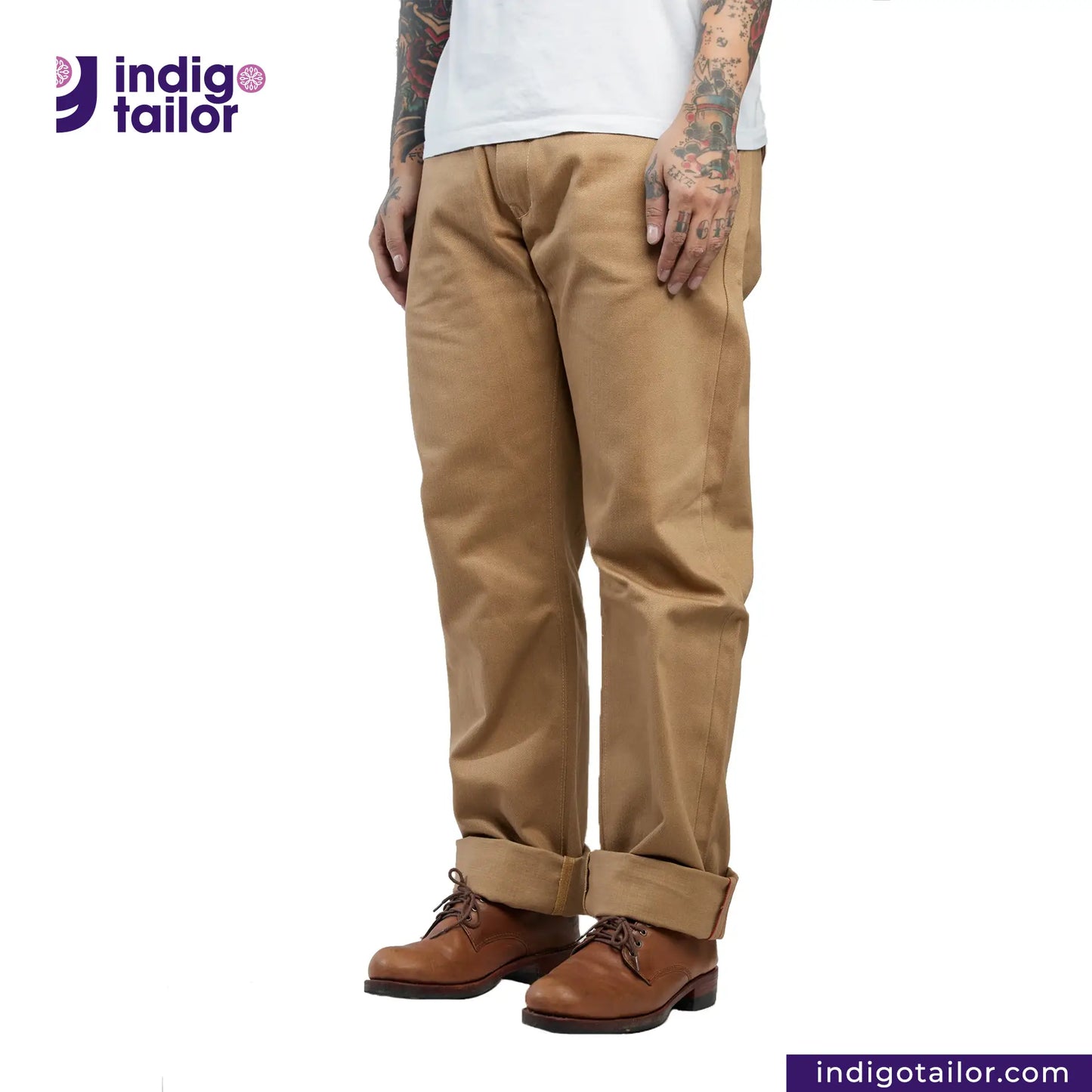 Person wearing Officer Trousers (Khaki) pants and brown boots with 'Indigo Tailor' logo and website on a white background