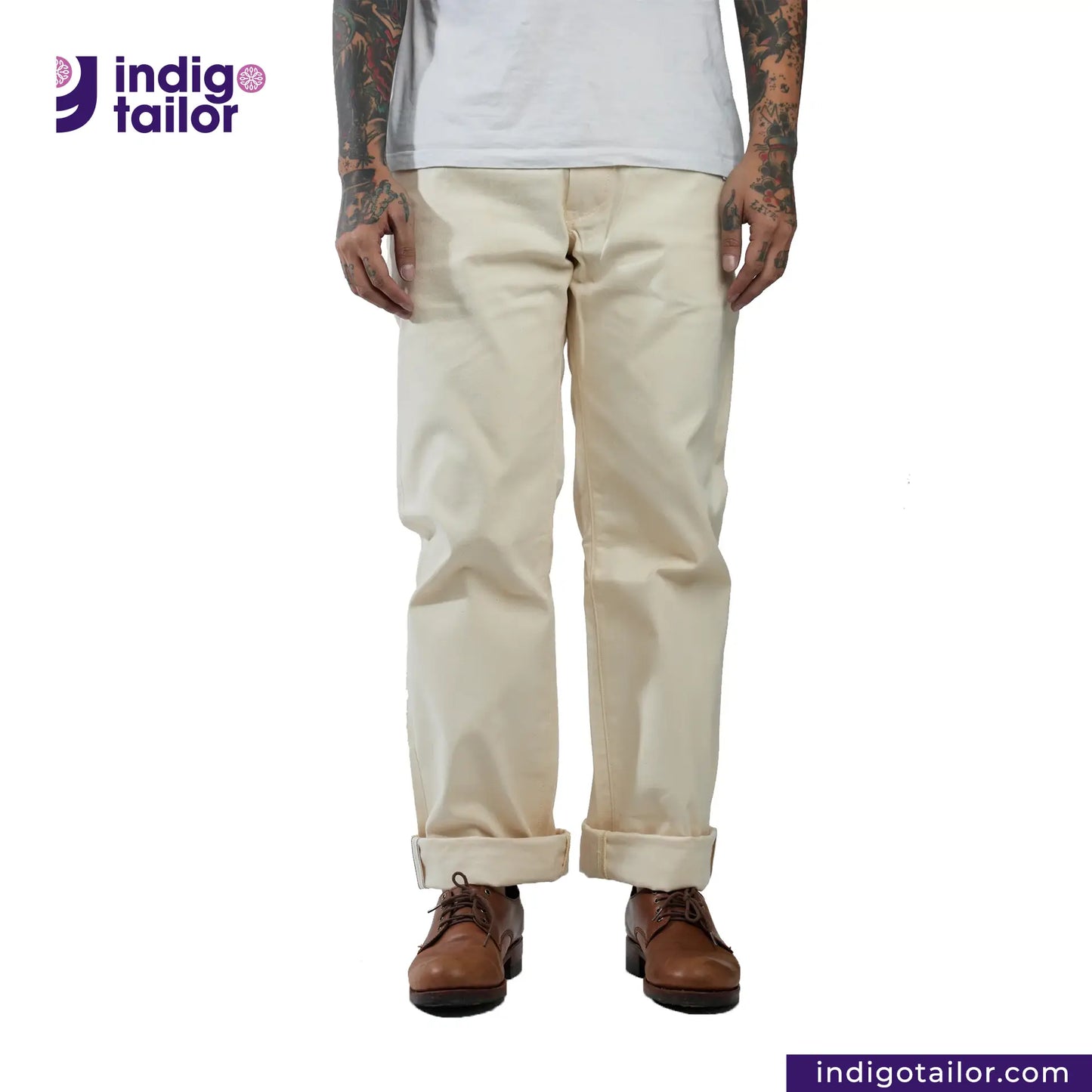 Person wearing Officer Trousers (Off-White) pants with 'Indigo Tailor' logo and website URL on a white background