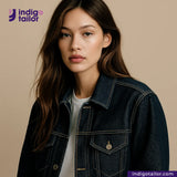 Woman wearing a RIGID INDIGO SELVEDGE DENIM jacket with Indigotailor logo and website on a beige background