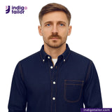Man wearing a SATURATED INDIGO GOLDEN SELVEDGE shirt with Indigotailor logo and website on a white background