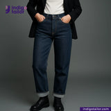Person wearing SLUBBY INDIGO SELVEDGE DENIM jeans with a gray background and 'Indigotailor' branding.