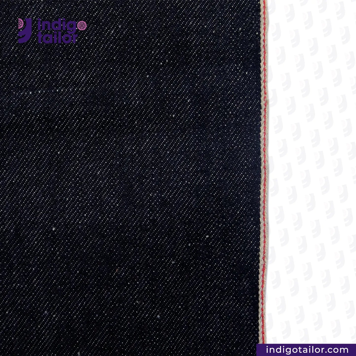 Close-up of SNOWY SELVEDGE DENIM fabric with a white background, featuring the Indigo Tailor logo.
