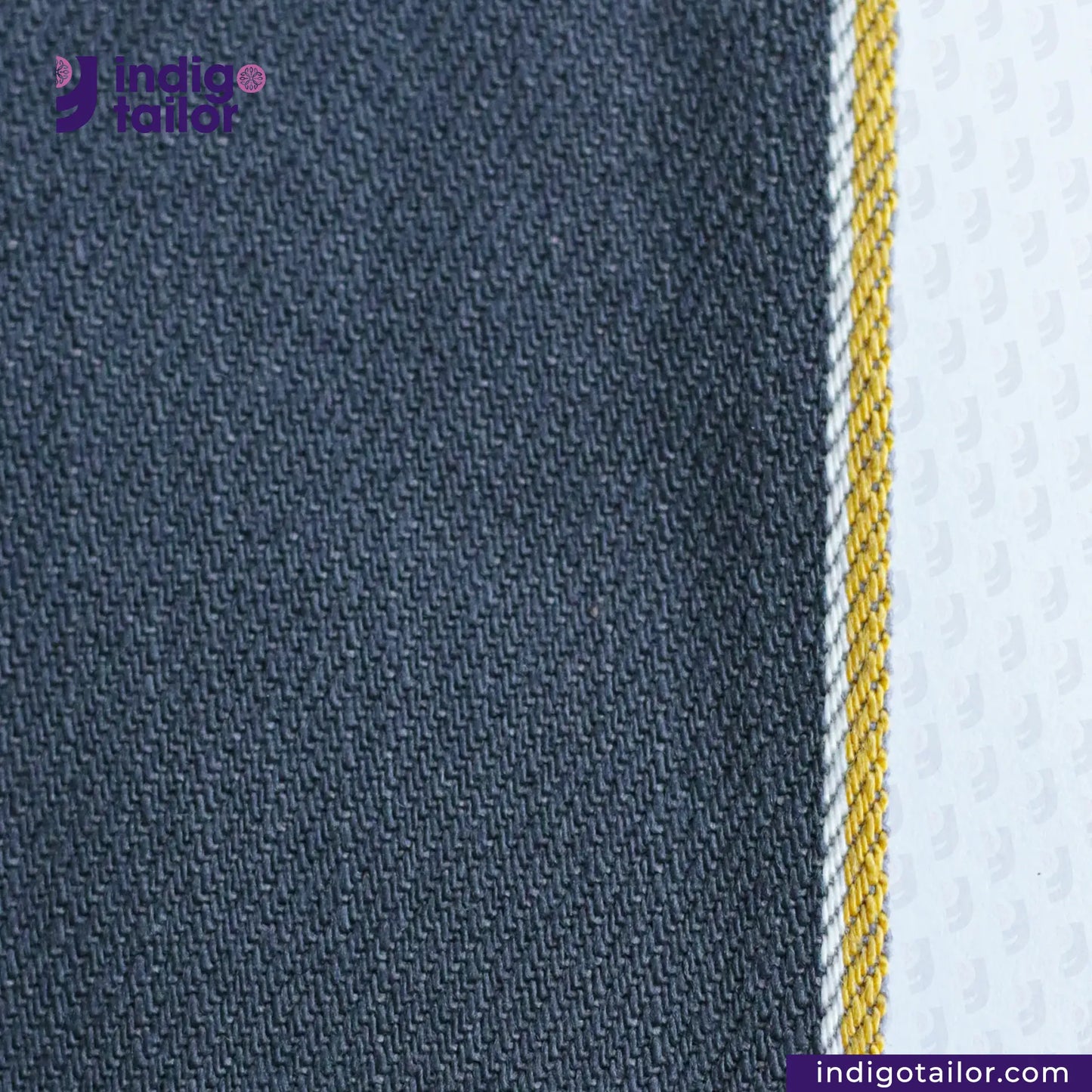 Close-up of SPACE GREY DENIM fabric with a visible brand logo and website text.