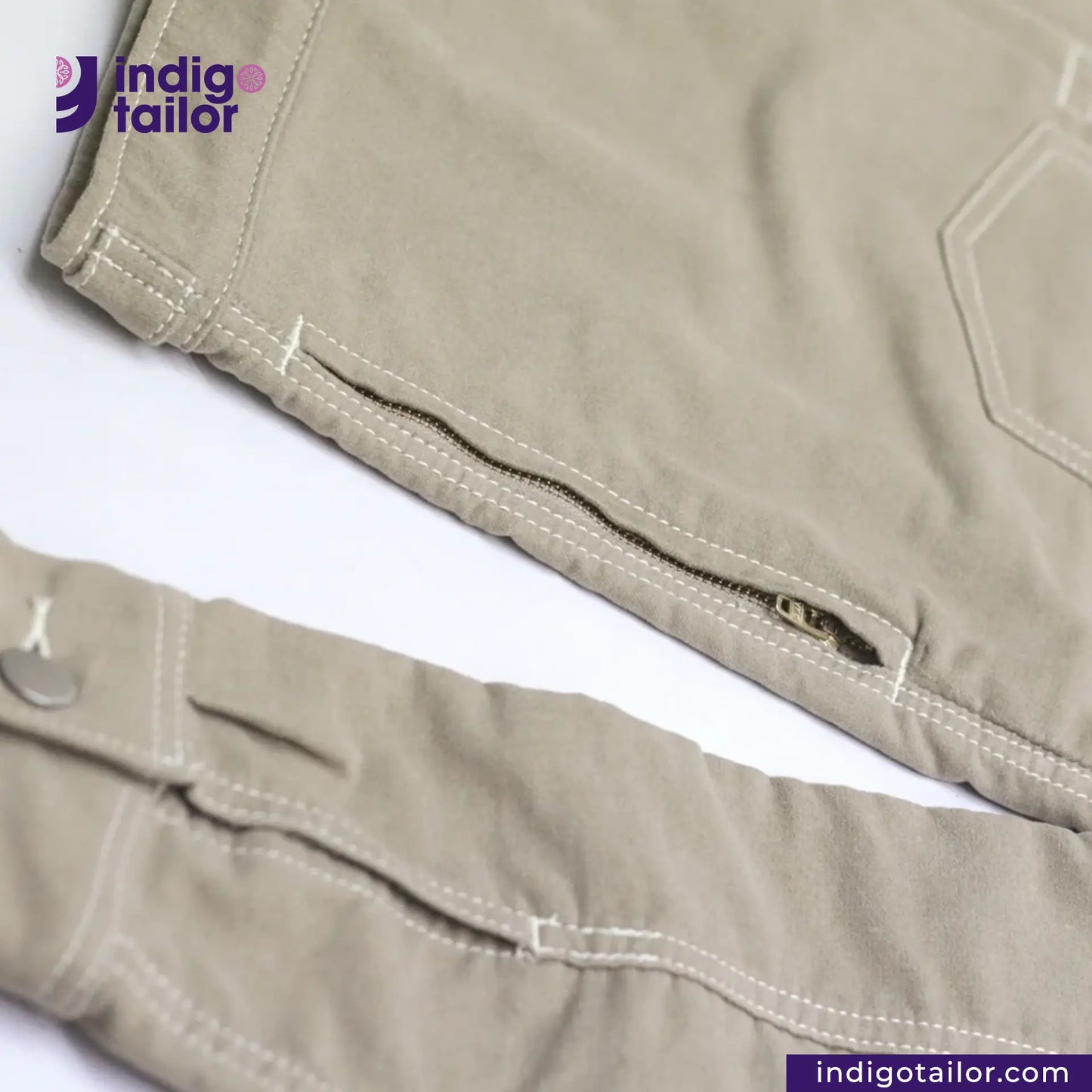 Close-up of SUEDE JACKET with a visible brand logo on a white background