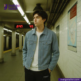 Person wearing a SUMMER SASHIKO DOBBY jacket in a subway setting with Indigotailor branding.