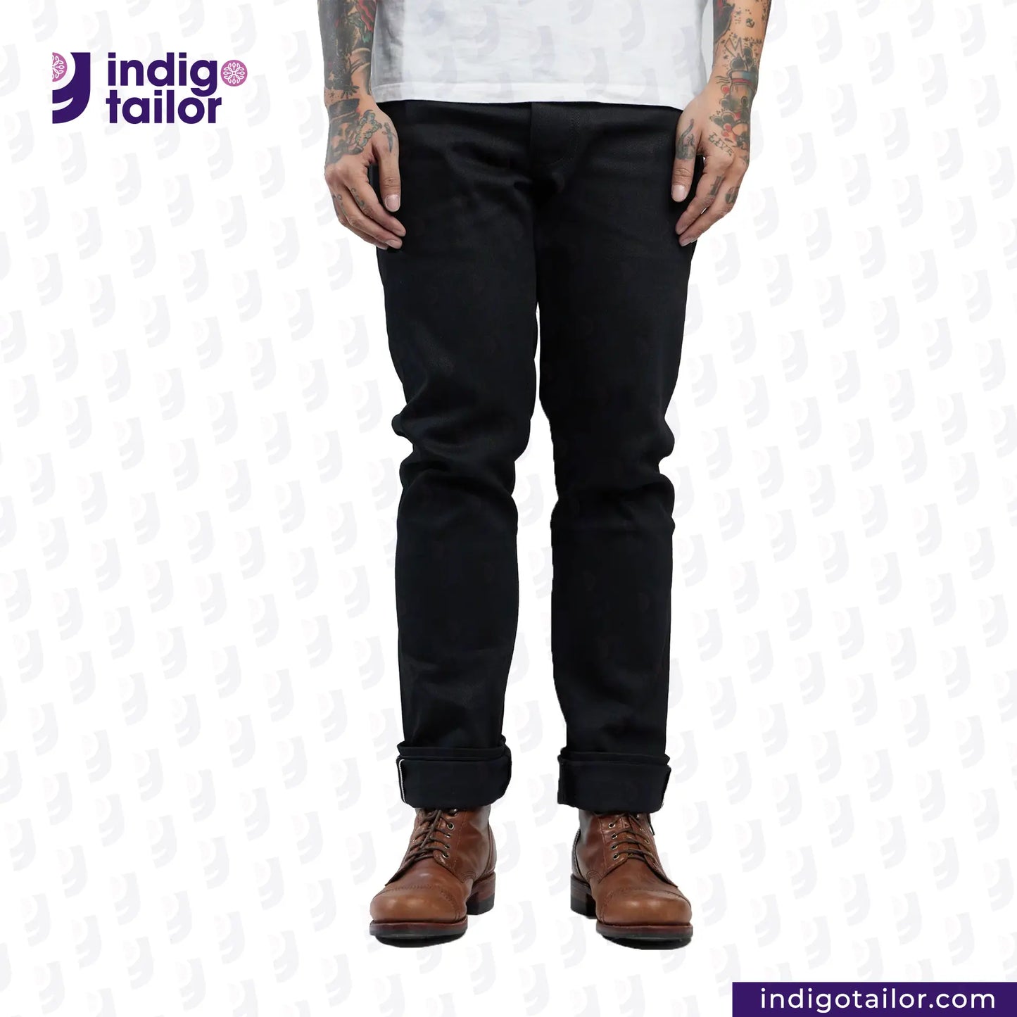 Person wearing SUPER BLACK DENIM jeans with 'Indigotailor' logo and website on a white background
