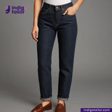 Person wearing TATE OCHI DOUBLE RING SPUN SELVEDGE DENIM jeans with 'Indigotailor' logo on a gray background