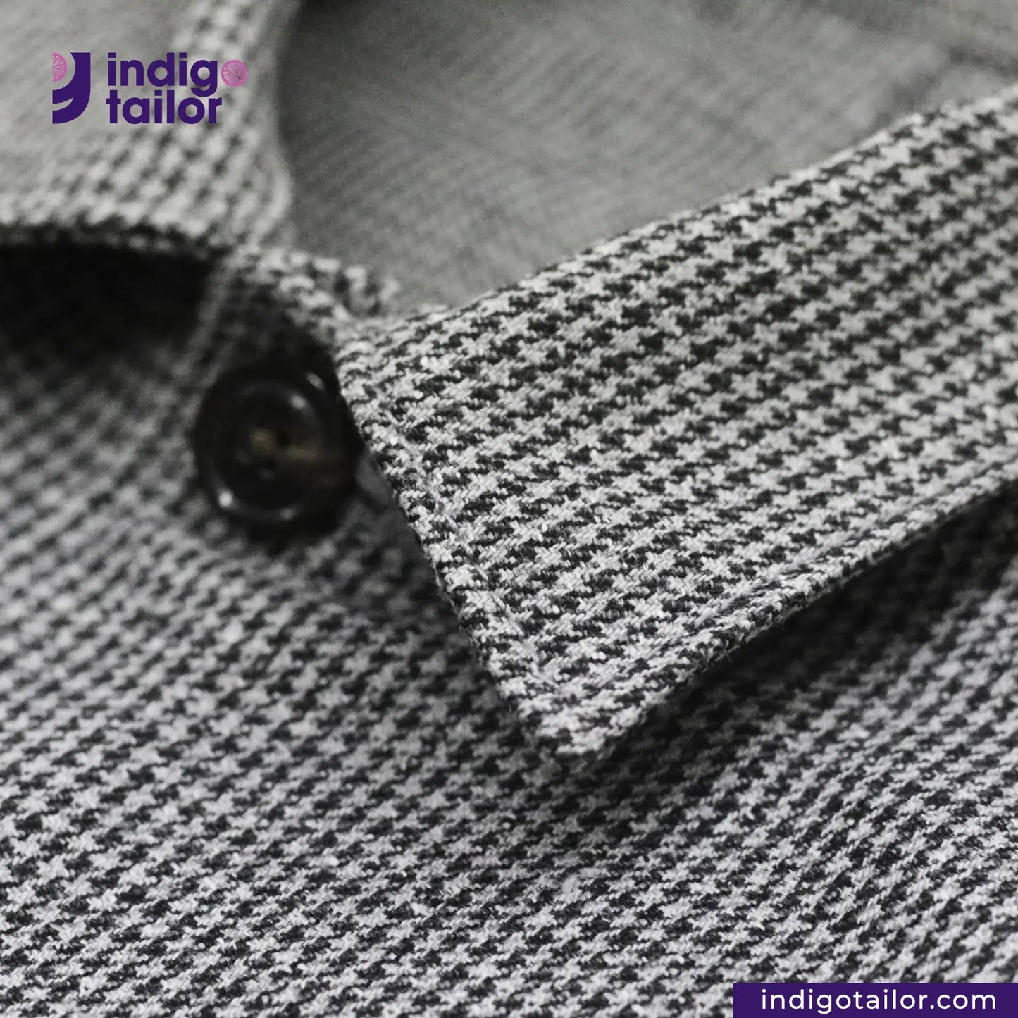 Close-up of a TWEED HOUNDSTOOTH COVERALL JACKET color with a button, featuring the 'indigotailor' brand.