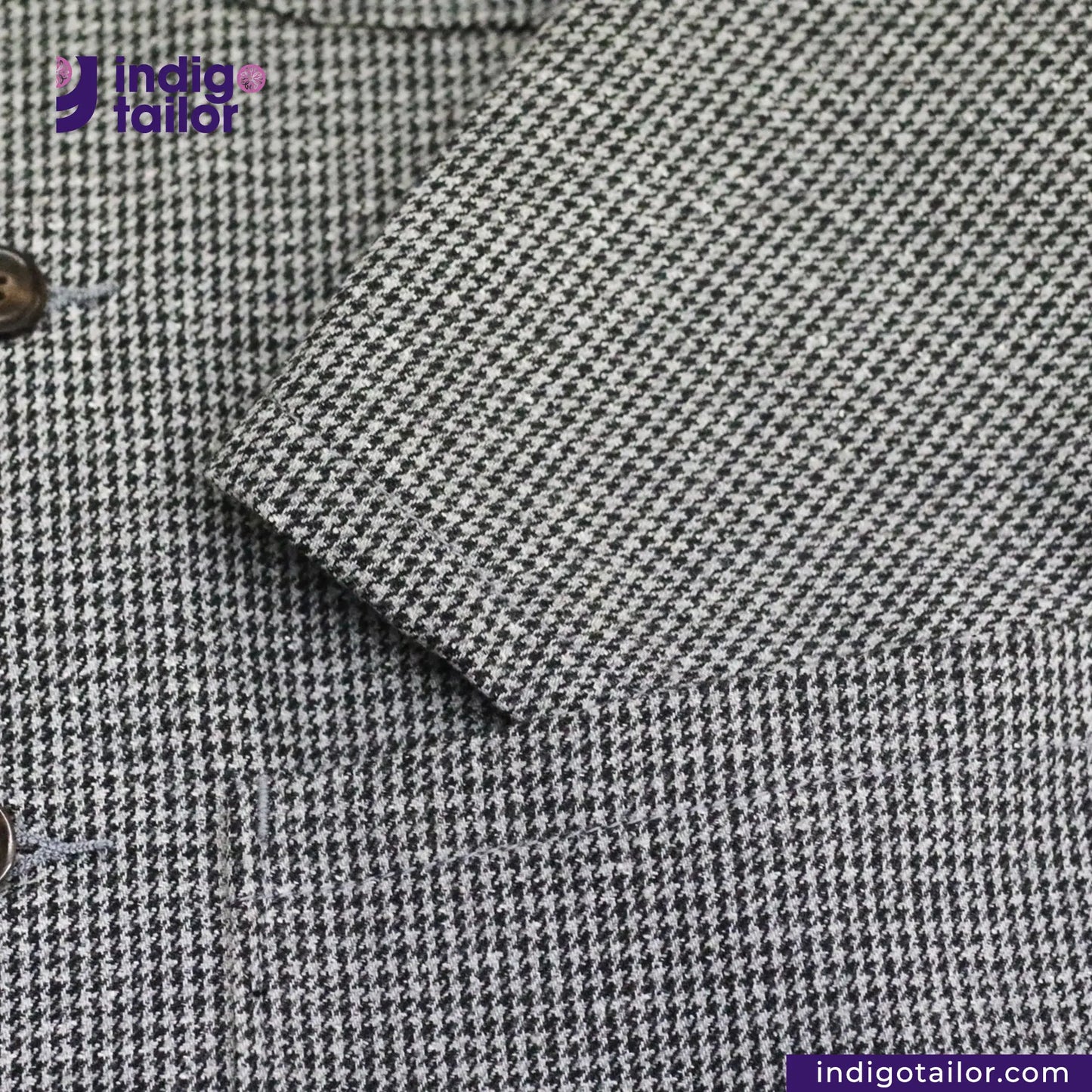 Close-up of TWEED HOUNDSTOOTH COVERALL JACKET pattern fabric with 'Indigotailor' branding.
