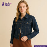 Woman wearing a VINTAGE SLUB DENIM jacket with Indigotailor logo and website on beige background