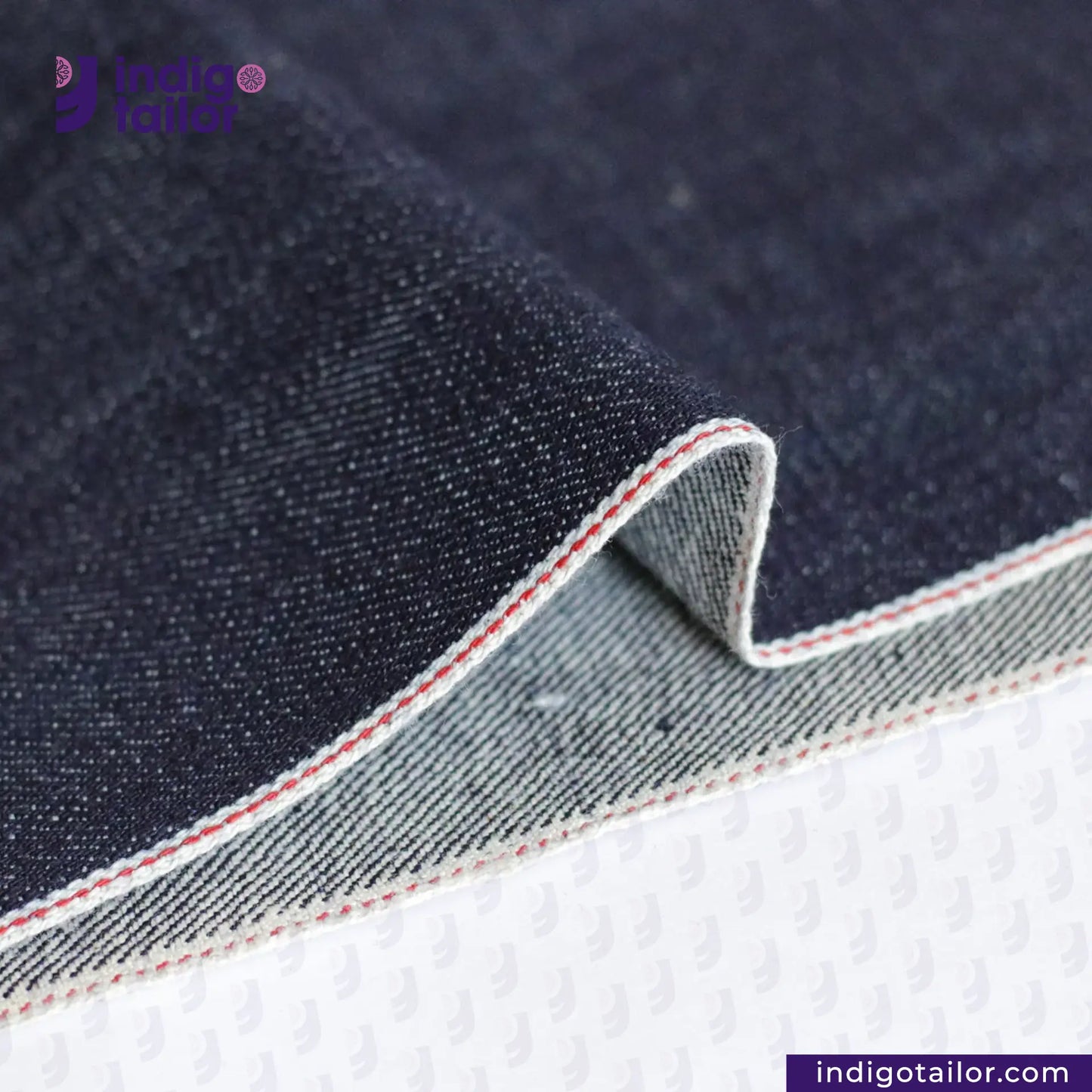Close-up of VINTAGE SLUB DENIM fabric with a visible brand logo and website.